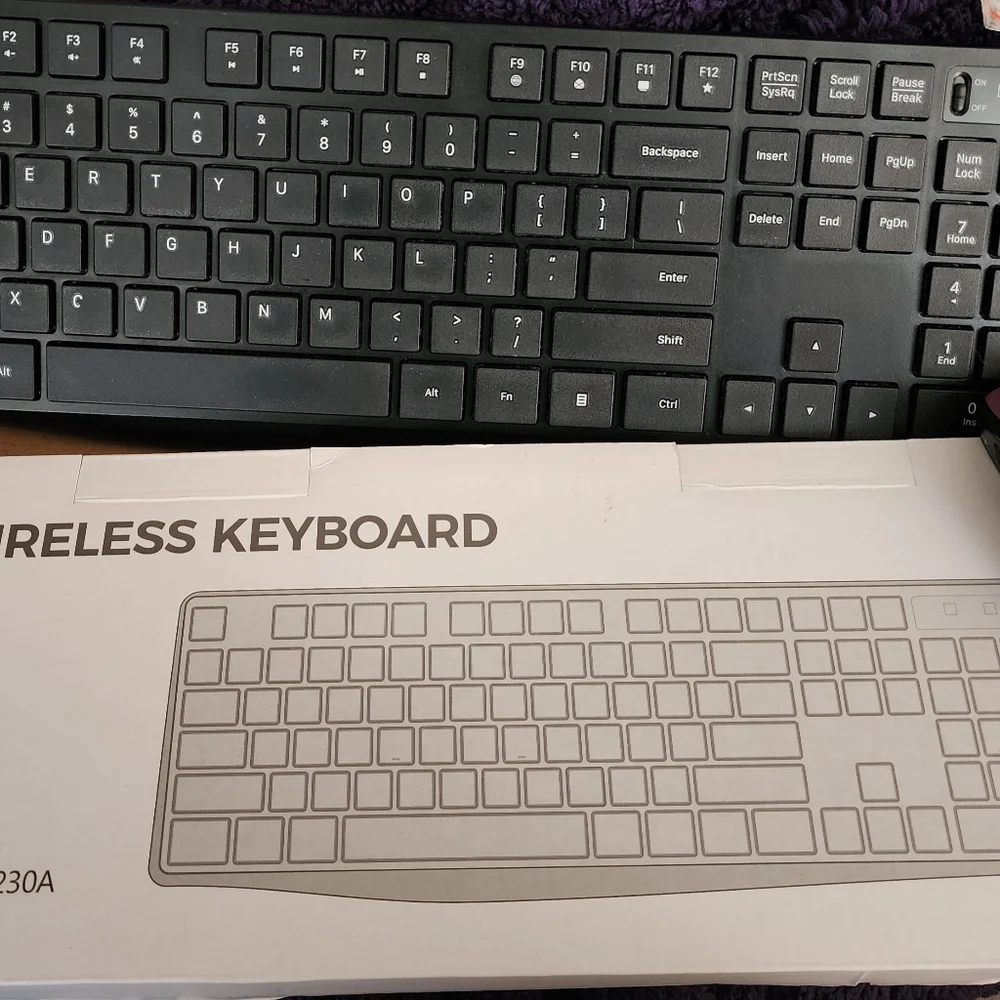 Wireless Keyboard Is Black andTECK NET Mouse Is Black and Purple U Get Both